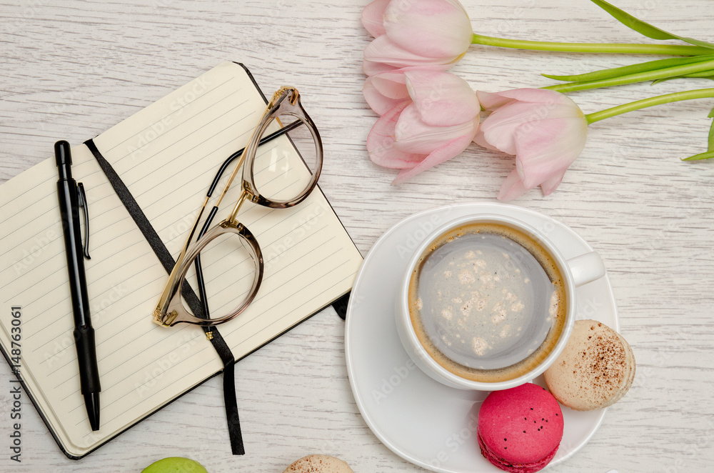 Planning of affairs. Coffee mug with dessert, notebook, pen and glasses. Planning of affairs. Coffee mug with dessert, notebook, pen and glasses.