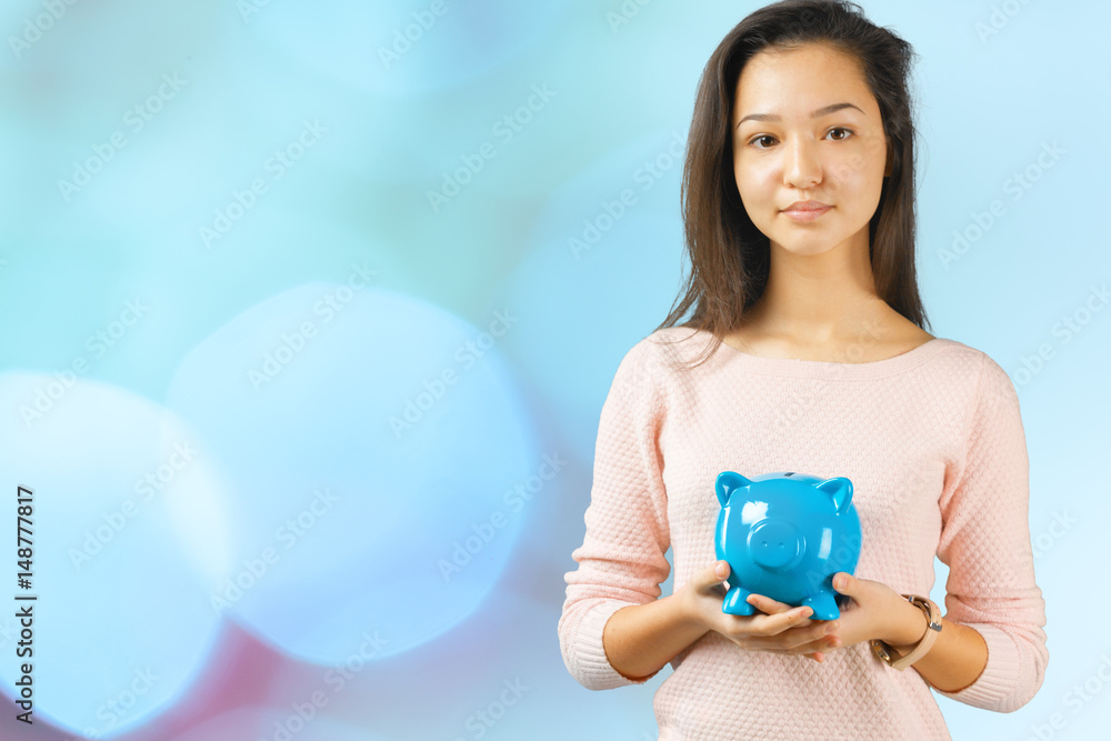Woman holding piggy bank Woman holding piggy bank