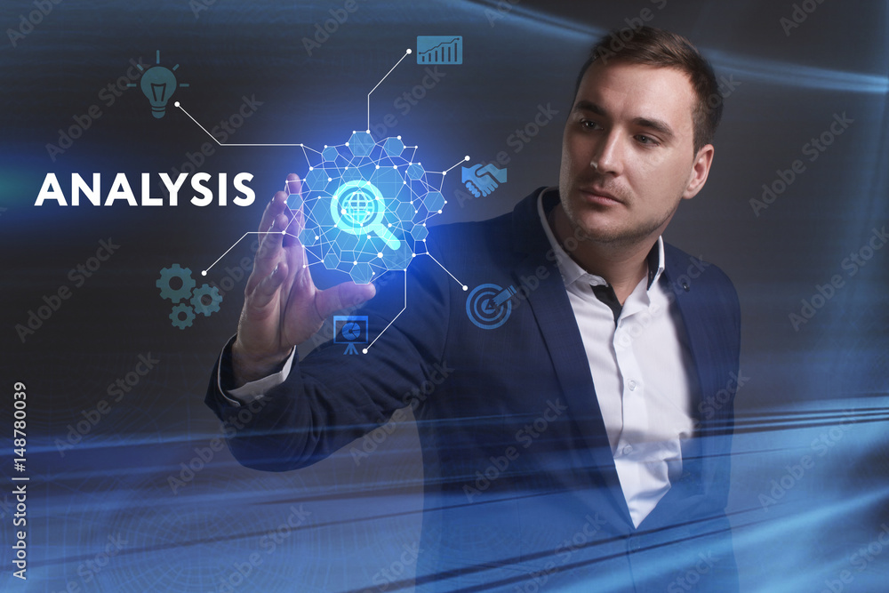 Business, Technology, Internet and network concept. Young businessman working on a virtual screen of the future and sees the inscription: Analysis Business, Technology, Internet and network concept. Young businessman working on a virtual screen of the future and sees the inscription: Analysis