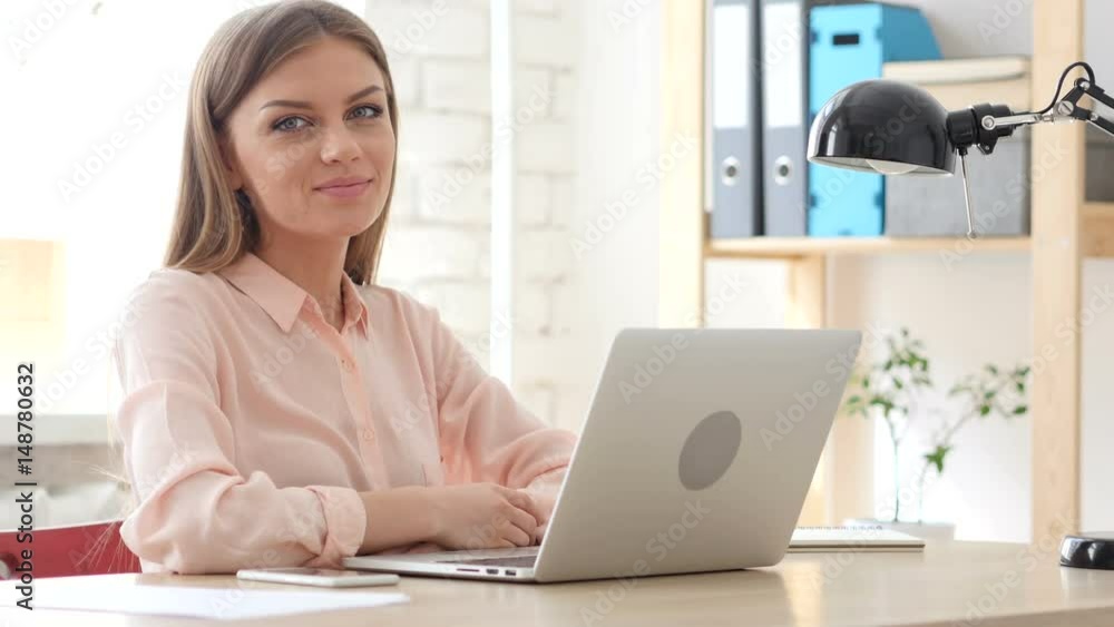 Creative Woman at Work Smiling toward Camera Creative Woman at Work Smiling toward Camera