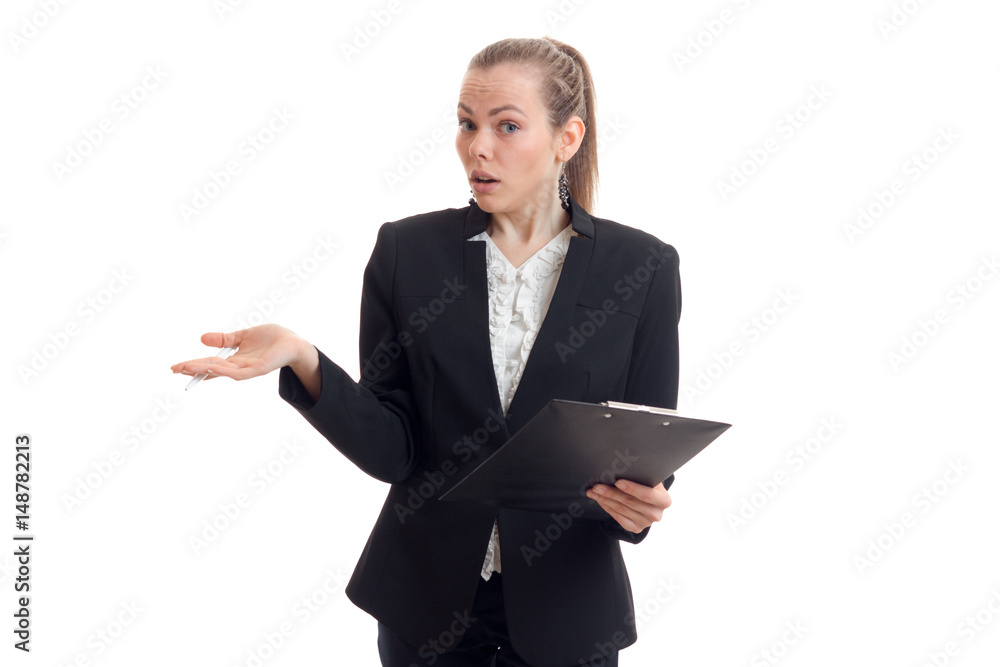 beautiful young girl in a black suit holding the tablet in her hand and is surprised at camera beautiful young girl in a black suit holding the tablet in her hand and is surprised at camera
