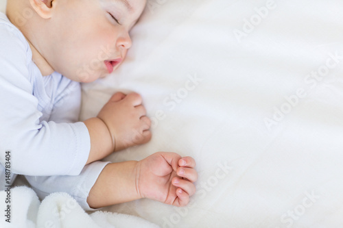 Εκτύπωση καμβά Close-up portrait of adorable baby boy sleeping in bed, 1 year old baby concept