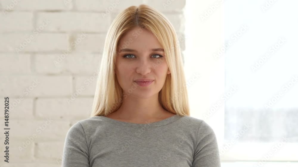 Portrait of Young Woman Waving Hand to Welcome Portrait of Young Woman Waving Hand to Welcome