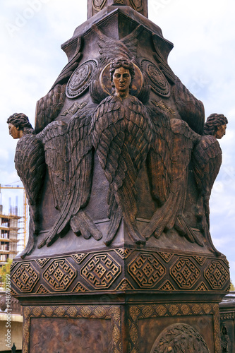 reedom Bridge, Bronze Seraphim light posts guard over the bridge from elevated pillars ove Vardar River photo