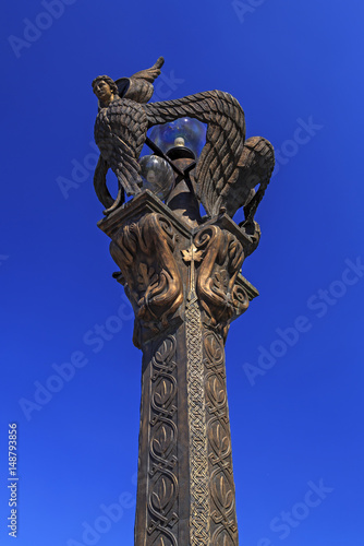 reedom Bridge, Bronze Seraphim light posts guard over the bridge from elevated pillars ove Vardar River photo