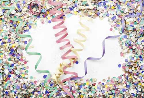 Background of confetti and serpentine. Copyspace. Carnival, party, celebration. photo