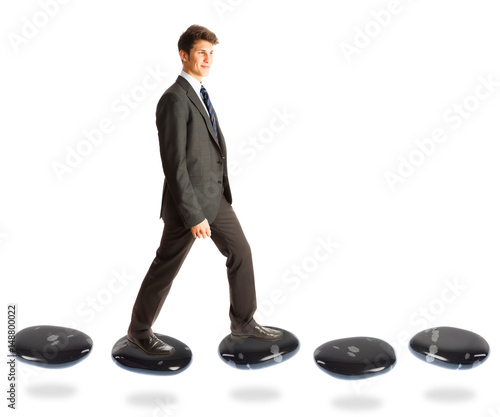 Businessman On Stepping Stones