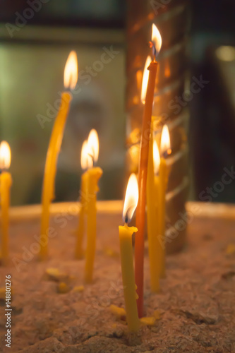 the lit candles in church against