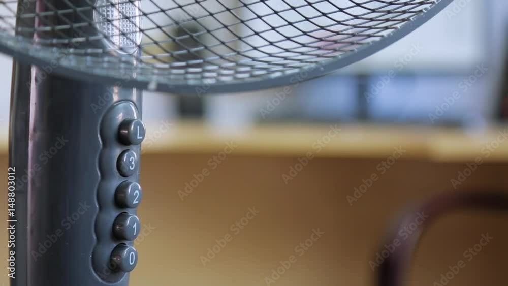click the hand on the button of the air fan click the hand on the button of the air fan