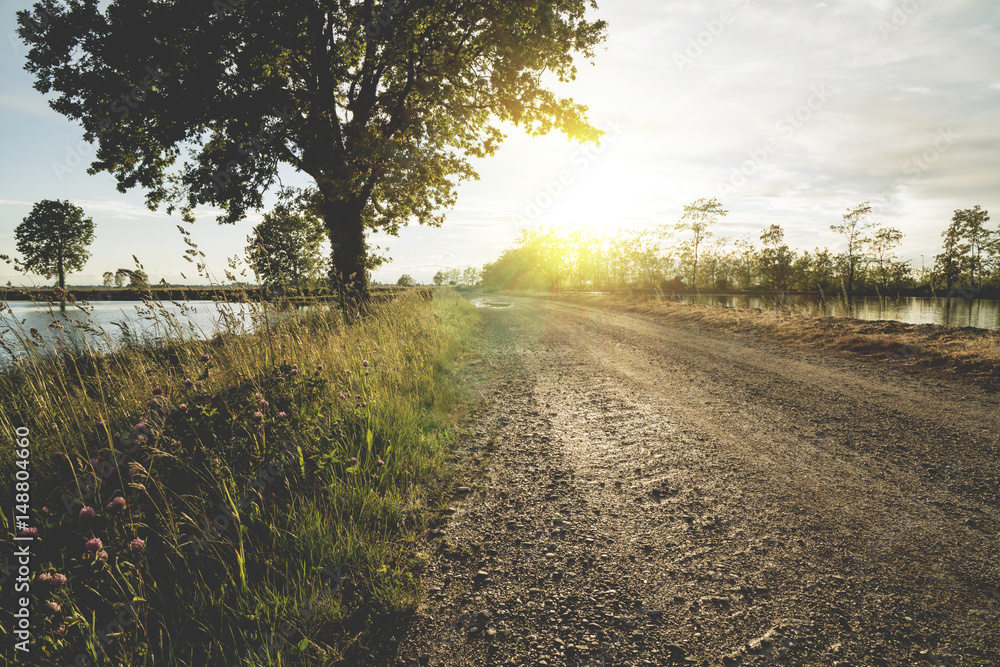 Dirt road at sunset