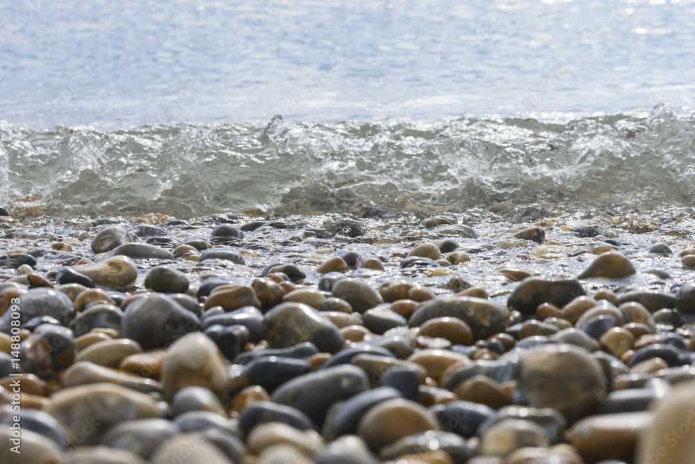 Water rippling onto pebbles.