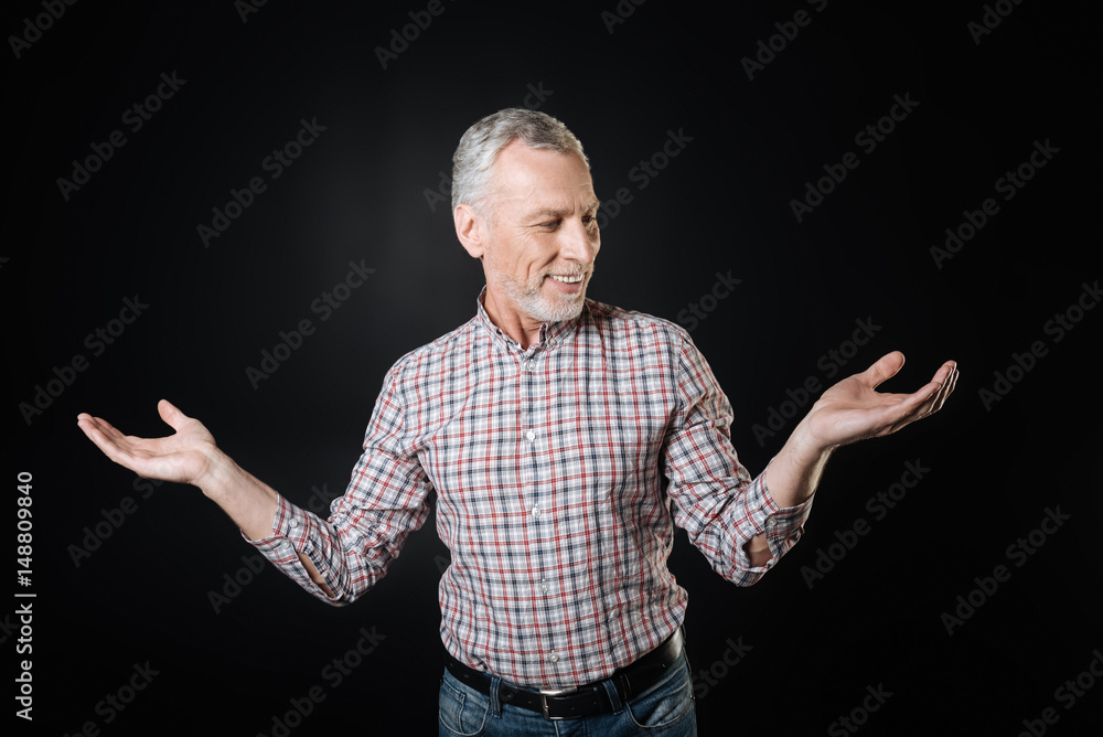 Delighted male person being at a loss Delighted male person being at a loss