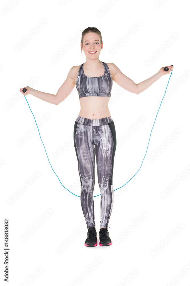 Young, pretty teenager with jumping rope Young, pretty teenager with jumping rope