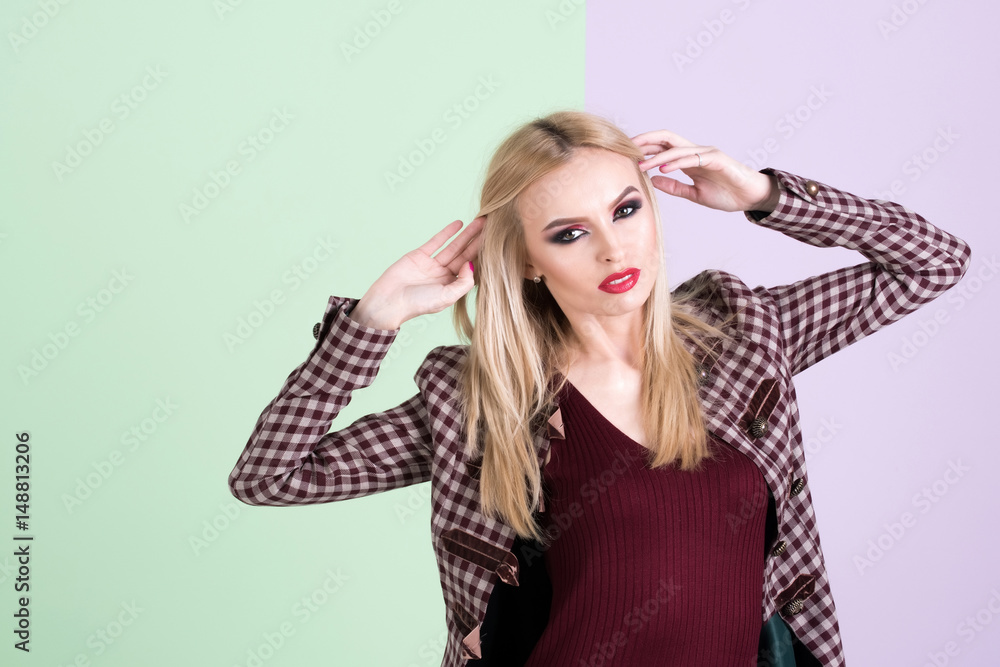 Fototapeta premium beautiful woman with makeup in dress and fashionable coat