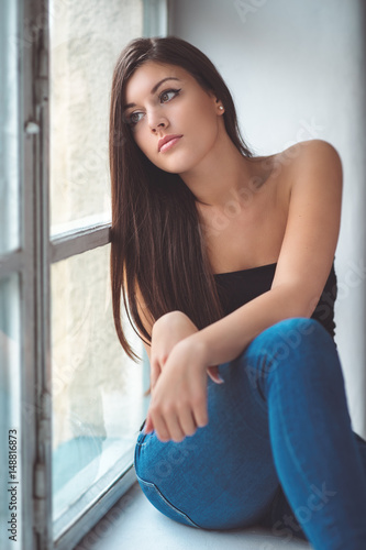 Free Download Beautiful young woman at the window - GFXLoad