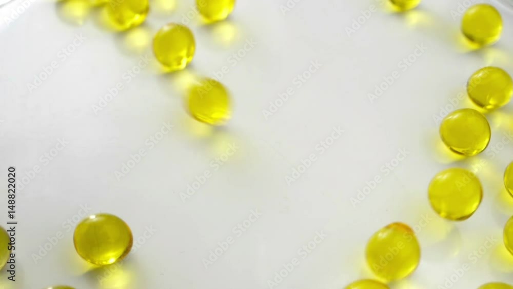 Transparent yellow balls down. Slow motion. Transparent yellow balls down. Slow motion.