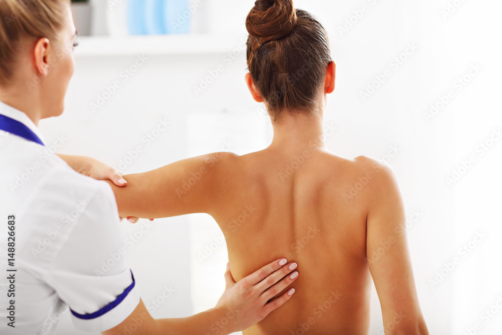 A picture of woman having back therapy A picture of woman having back therapy