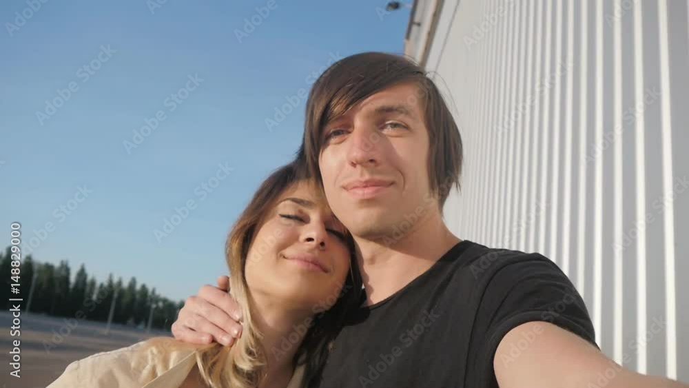 Young beautiful family doing selfie. The guy gently caresses the girl on the head. Young beautiful family doing selfie. The guy gently caresses the girl on the head.