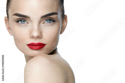 Fashion Makeup. Young Woman With Perfect Makeup And Red Lips