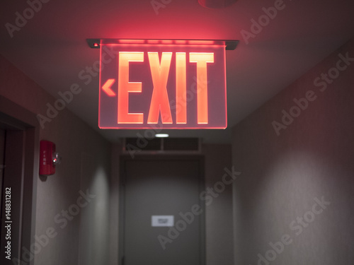 Glowing red exit sign.