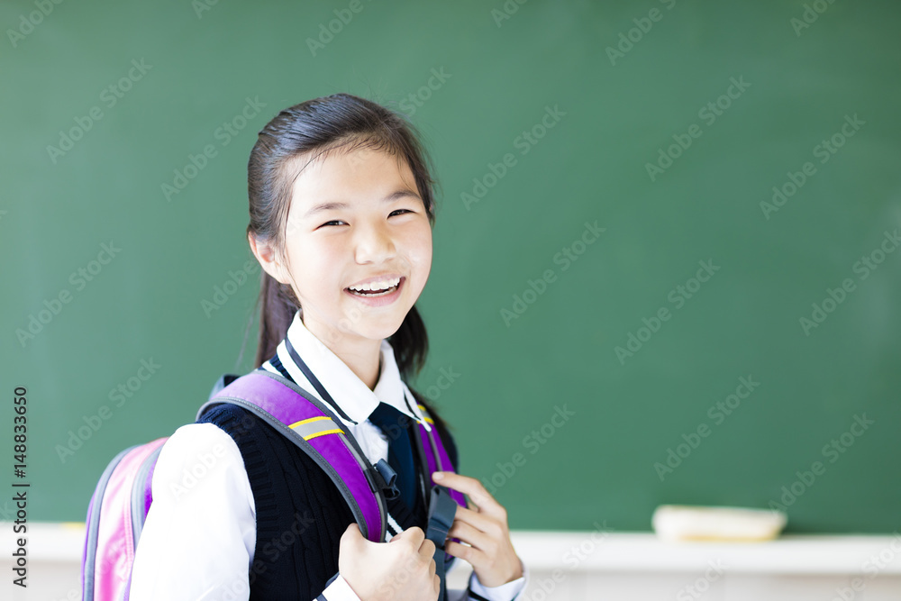 smiling  teenager student girl in  classroom
