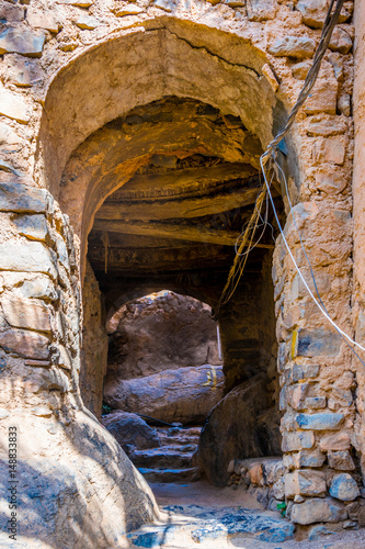 View of a narrow street of the Misfat al abriyeen village in Oman. photo