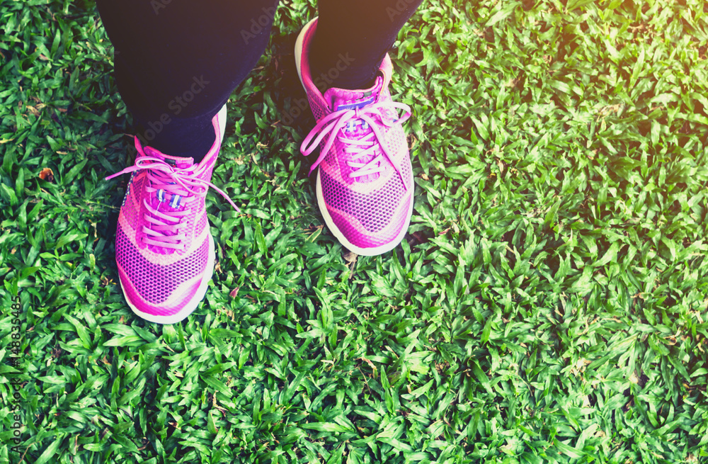 Female runner on green grass Female runner on green grass