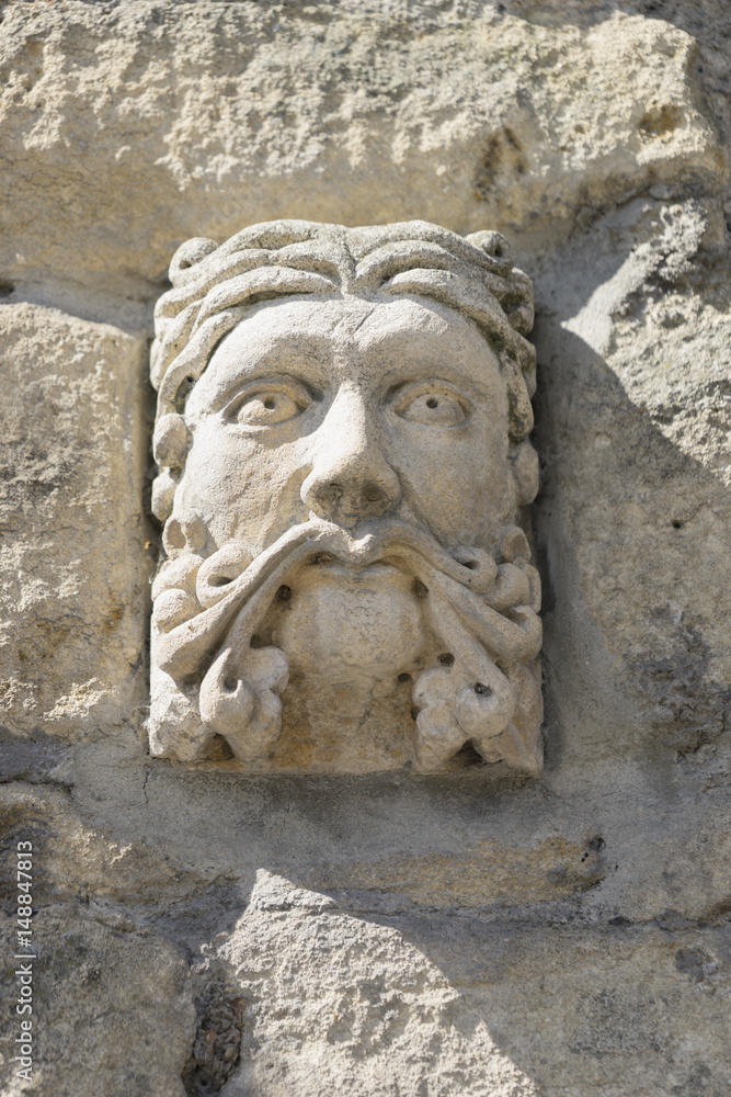 Gargoyle on wall in Bath, UK. Gargoyle on wall in Bath, UK.