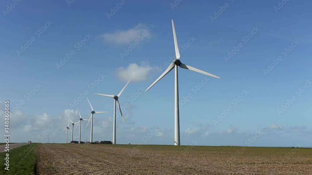 Wind turbines of a power plant for electricity generation in Normandy, France. Concept of renewable sources of energy. Environmentally friendly electricity production Wind turbines of a power plant for electricity generation in Normandy, France. Concept of renewable sources of energy. Environmentally friendly electricity production