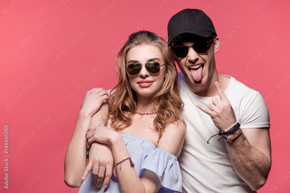 young stylish couple at casual clothes posing and fooling around, young couple in love