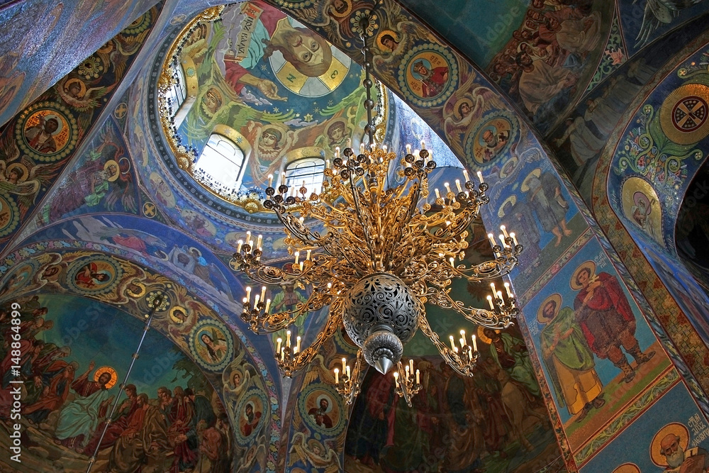 Mosaics and an ornate chandelier in the interior of the Church of the Savior on Spilled Blood