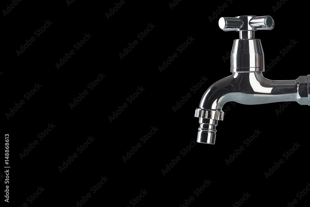 Faucet on black background