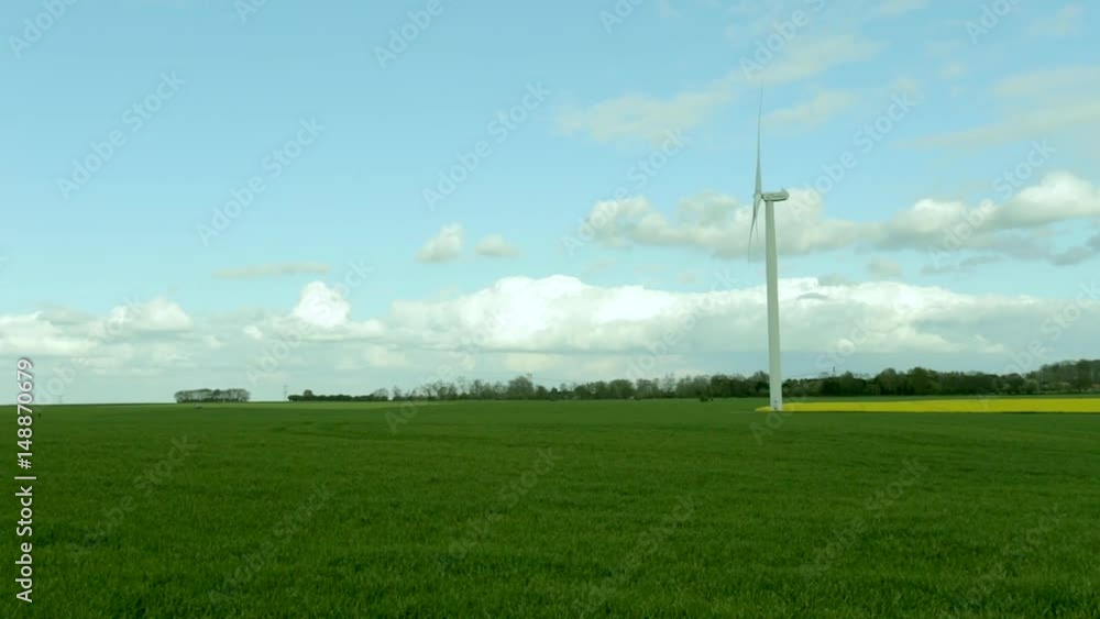 wind turbines of a power plant for electricity generation in France. Agricultural fields. Concept of renewable sources of energy. Environmentally friendly electricity production wind turbines of a power plant for electricity generation in France. Agricultural fields. Concept of renewable sources of energy. Environmentally friendly electricity production