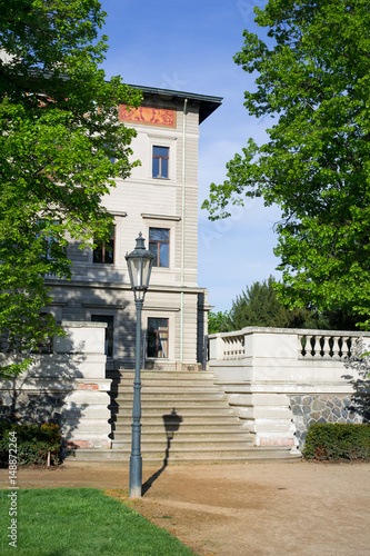 Grebovka, Havlicek gardens, Prague - Vinohrady, Czech Republic / Czechia - popular and beautiful park in the center of the city. Lantern, green grass and villa during sunny summer photo