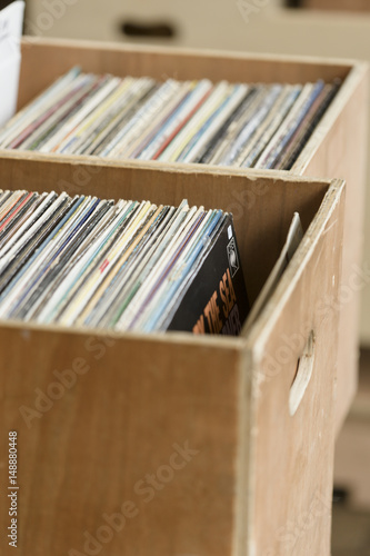 Old vinyl records in wooden box.