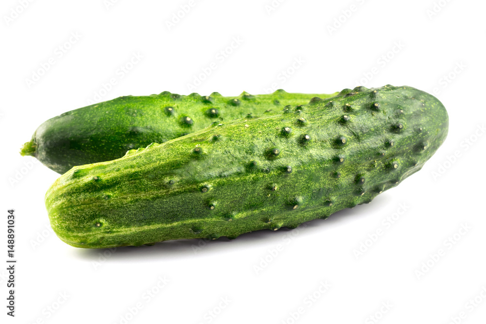Two fresh cucumbers isolated on white background, close-up view Two fresh cucumbers isolated on white background, close-up view