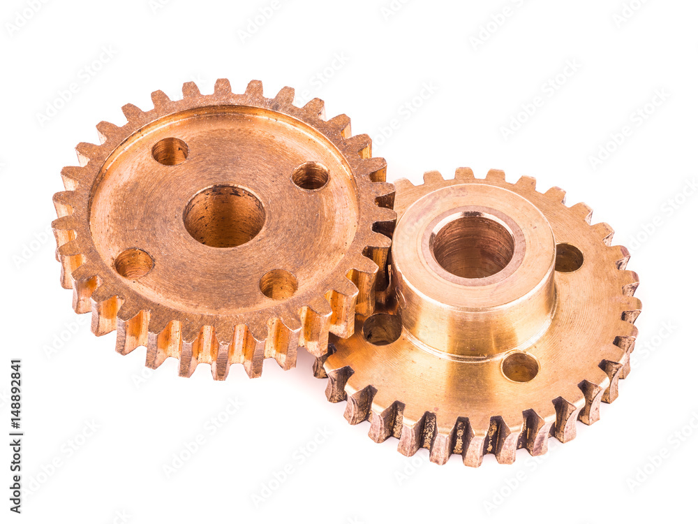 real brass metal gear on white background real brass metal gear on white background