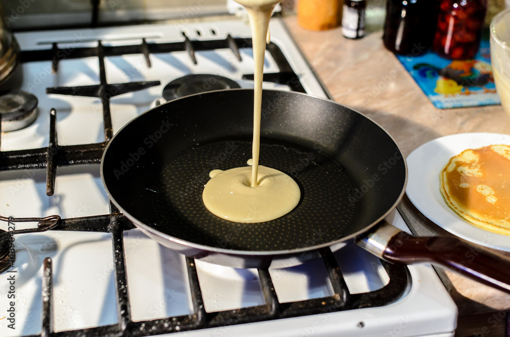 Cooking pancakes in a frying pan. Cooking pancakes in a frying pan.