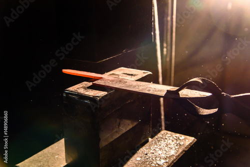 Forging molten metal. Making knives. photo