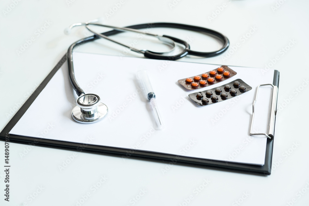 View of stethoscope, drug and equipment on foreground table, Health care and Medical concept View of stethoscope, drug and equipment on foreground table, Health care and Medical concept