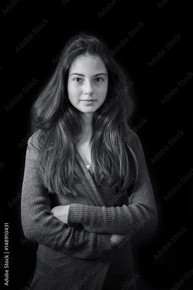 Monochrome portrait of young beautiful girl standing Monochrome portrait of young beautiful girl standing