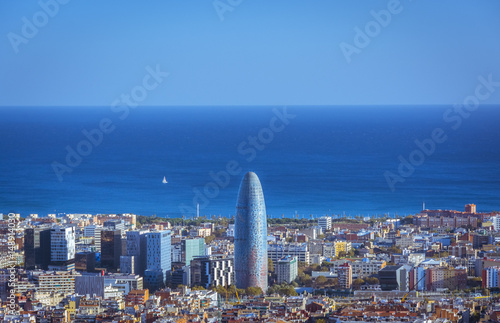 View of Barcelona, tower Agbar and the Mediterranean sea photo