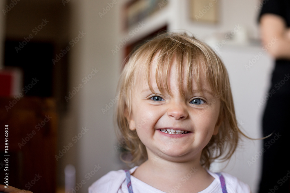 smiling happy young baby caucasian blonde girl portrait at home smiling happy young baby caucasian blonde girl portrait at home