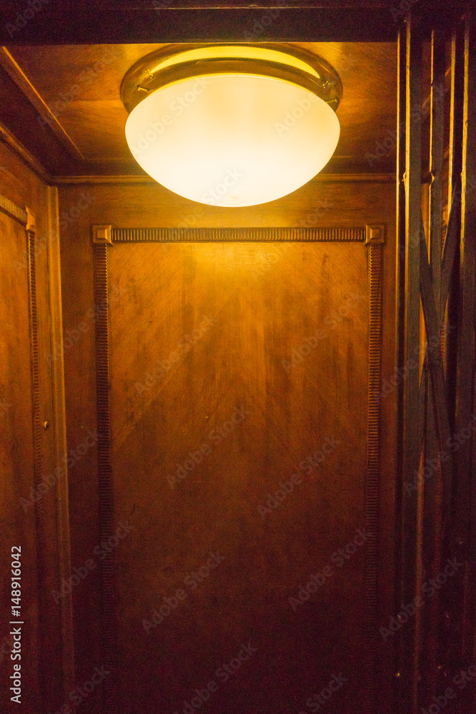 Bright light illuminates old lift carriage