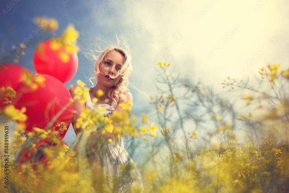 Girl in yellow field over sunny day