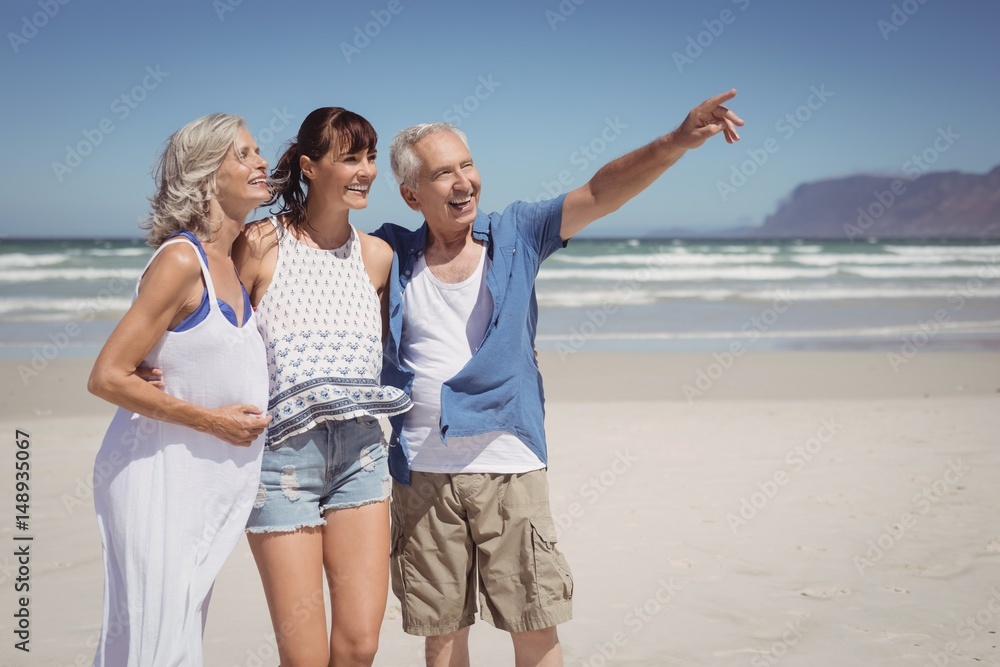 Senior man pointing away to show something Senior man pointing away to show something