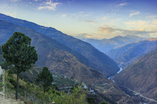 Valley with mountain range in the backgorund (Bhutan) photo