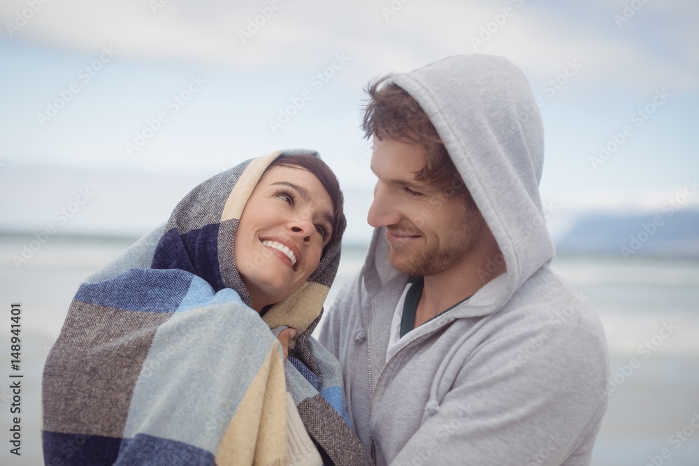 Young couple smiling during winter