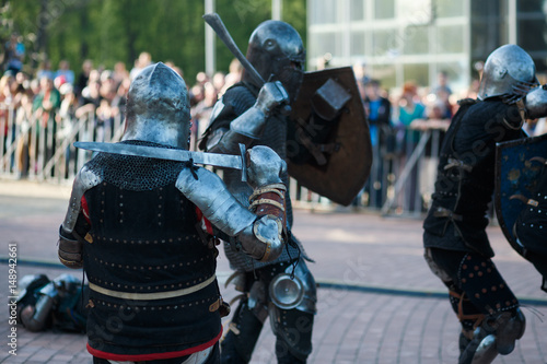 Fighting knightly view with a sword on his shoulder © Dental Pro Content