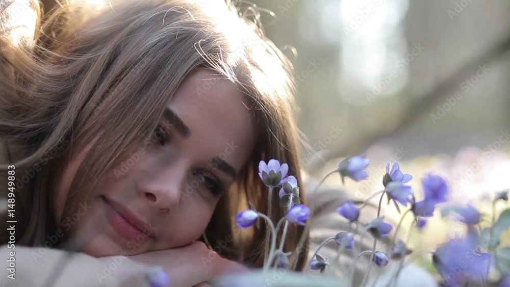 The girl in the Park admiring the snowdrops The girl in the Park admiring the snowdrops